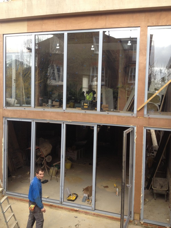 Aluminium bi-fold doors with two-storey glazing in Newport Pagnell