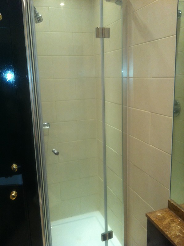 Frameless glass shower enclosure with chrome fittings in Newport Pagnell