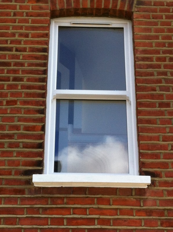 uPVC sash window on Victorian red brick house in Newport Pagnell